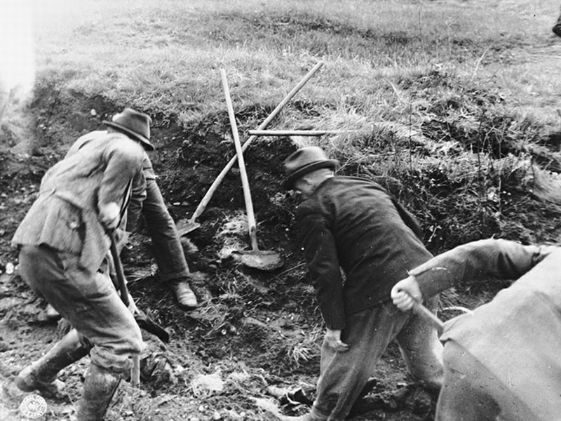 Signal Corps Photos: Disintering Bodies